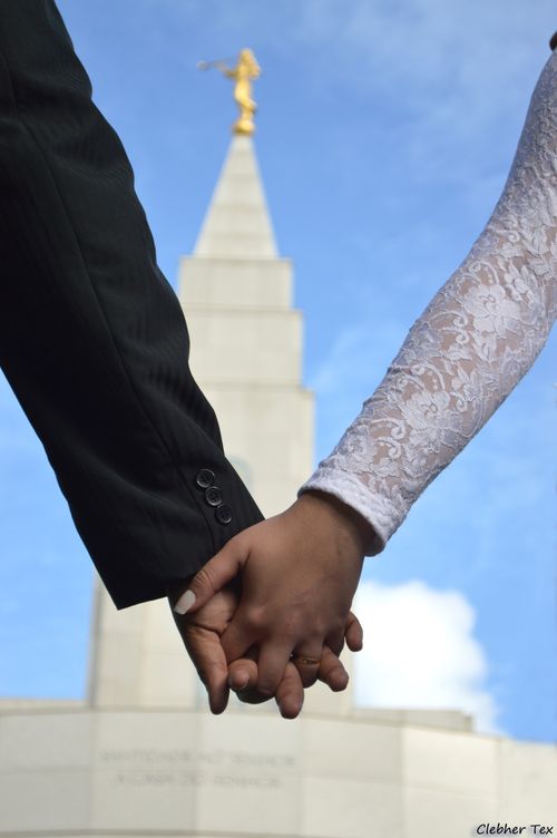 holding hands outside temple