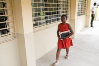 youth walking into a meetinghouse in Ghana