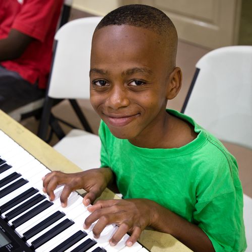 young man playing keyboard