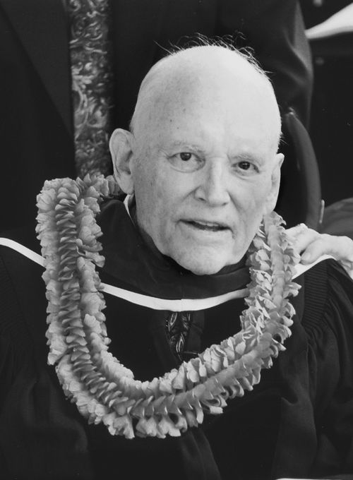 academic gown and lei