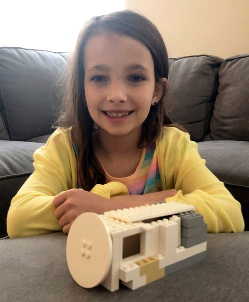 girl with tomb built from blocks