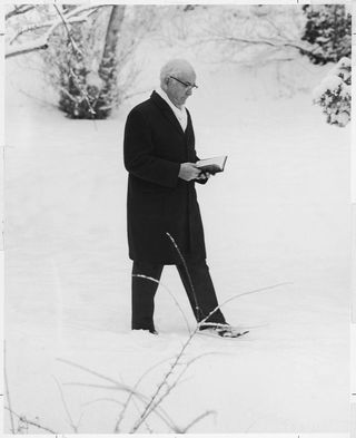 President Spencer W. Kimball studying scriptures