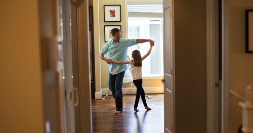 father and daughter dancing