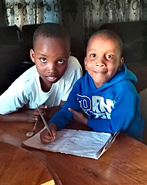 two brothers reading together