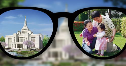 Looking through glasses, the focus on the temple and family