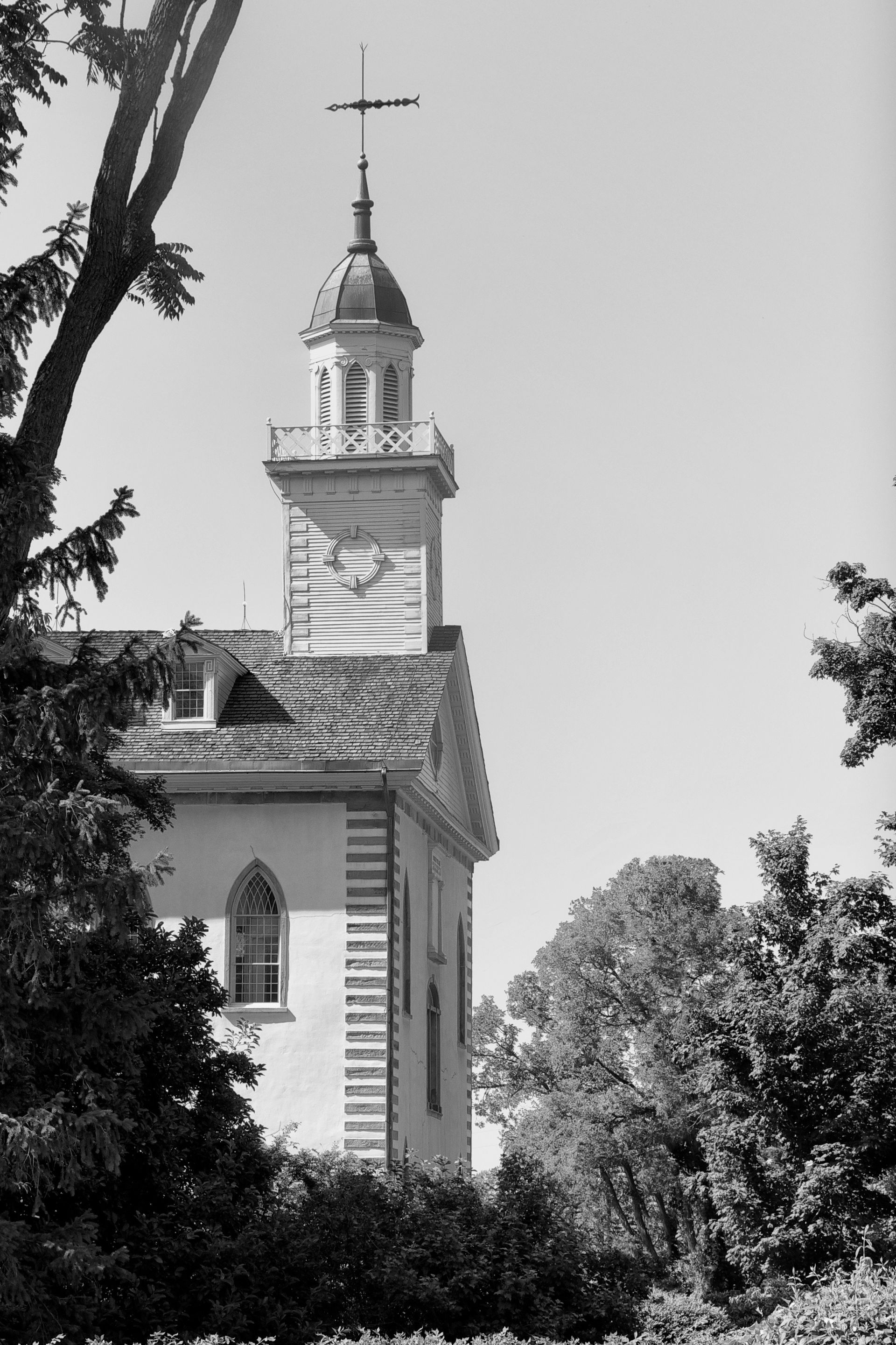 The Kirtland Temple spire in black and white, including scenery.