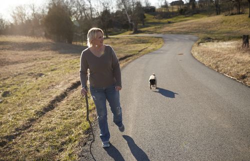 Shelly walking with her dog