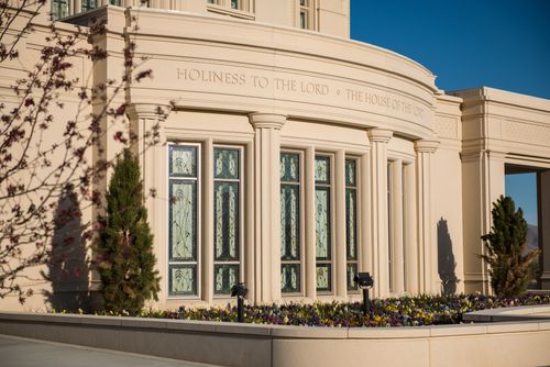 The stained-glass windows of the Payson Utah Temple underneath the inscription “Holiness to the Lord: The House of the Lord.”