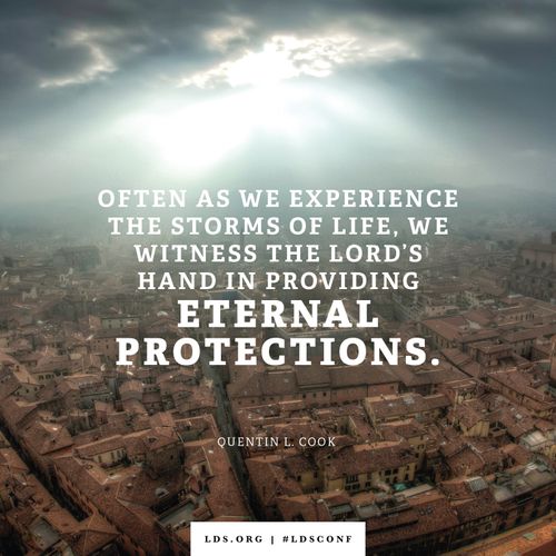 An image of a city combined with a quote by Elder Cook: “We witness the Lord’s hand in providing eternal protections.”