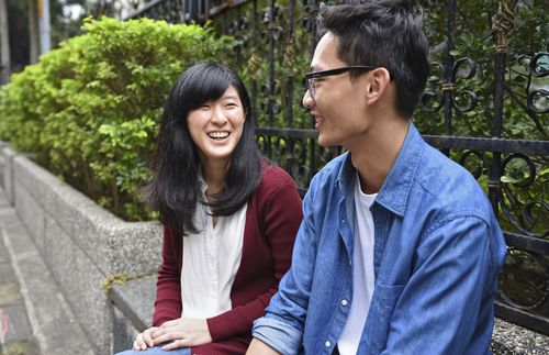 young woman and young man smiling