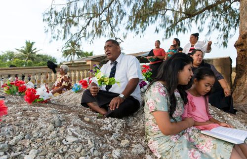 man and his family singing