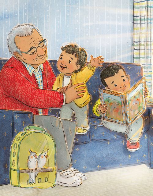 Uomo anziano seduto con dei bambini sul divano mentre un bambino legge un libro di storie delle Scritture