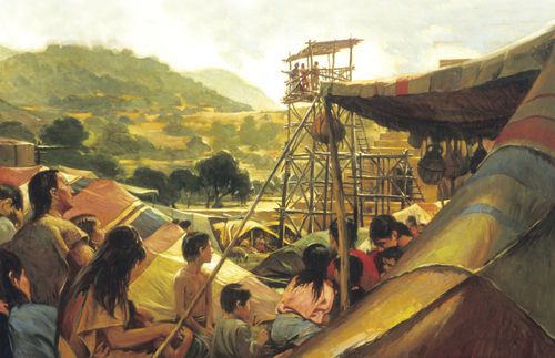 Large out door scene with a market square/campsite in the foreground and green hills in the background.  In the right foreground there is the side of alarge stuped  tent;  the tent has an awning supported by ropes and poles.  Hanging from the awning is a series of poles.  Underneath the awning is a mother with several children all in highly colored tunics and skirts.  In the left foreground is another family.  This family has a father with a daughter in hi lap, two women beside him (one with a child in her lap) and a young boy with no shirt.  Behind the man is another figure with a bowed head.  Threre are several other figures and tents in the picture, but they are across the ones in the foreground.  A large tower is the focus of the painting.  The tower appears like scaffolding with a shaded top.  On top of the tower are three men.  One wears a blue robe and speaks with outstretched arms.  The other two seem to be recording his words.  Behind the tower is a stone building with step shapped sides.  "Walter Ranes '03" appears in the lower right corner in red.   The Reverse side reads, "Walter Rane 2003/ In the Service of Your God Mosiah 2:17/ King Benjamin Addresses his People".