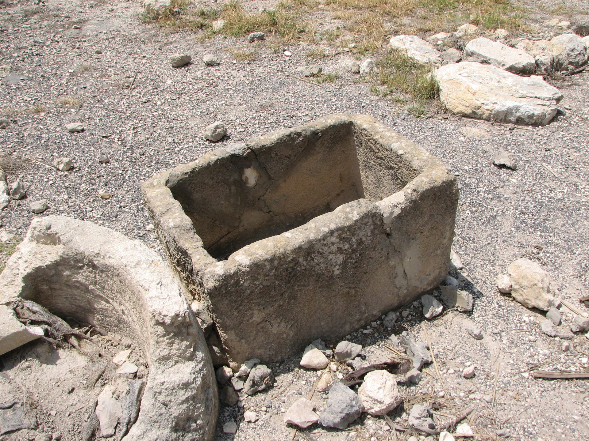 The remains of a square stone crib carved out to be used for feeding animals.