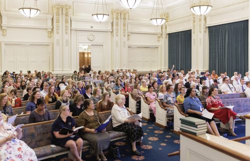 missionaries rehearsing as a choir 