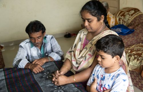 family praying