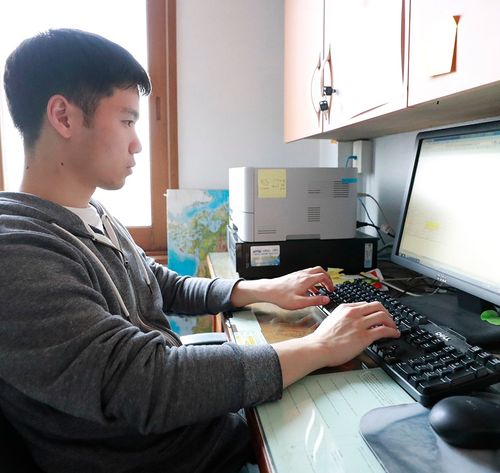 young man working on computer