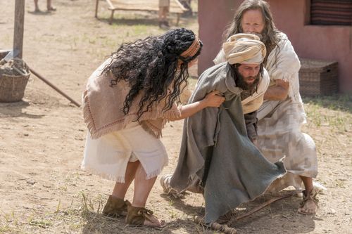 Jacob and his wife help a crippled man who was pushed to the ground.