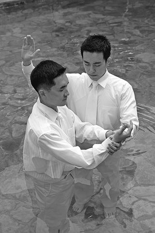 Young man being baptized