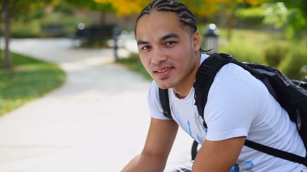 A young man sits on a bench contemplating the blessings of the gospel of Jesus Christ