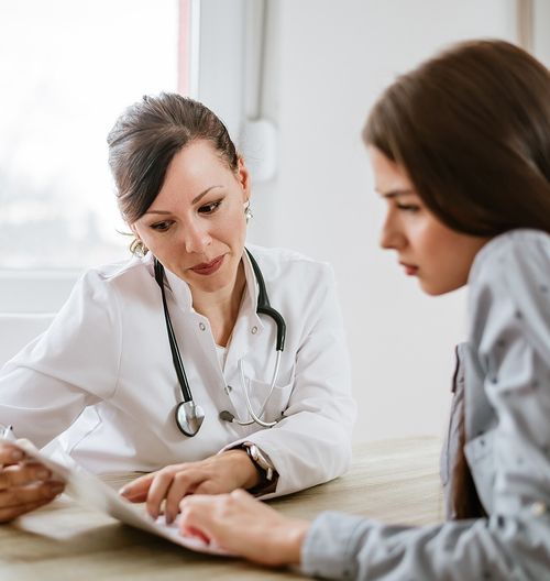 doctor speaking with patient