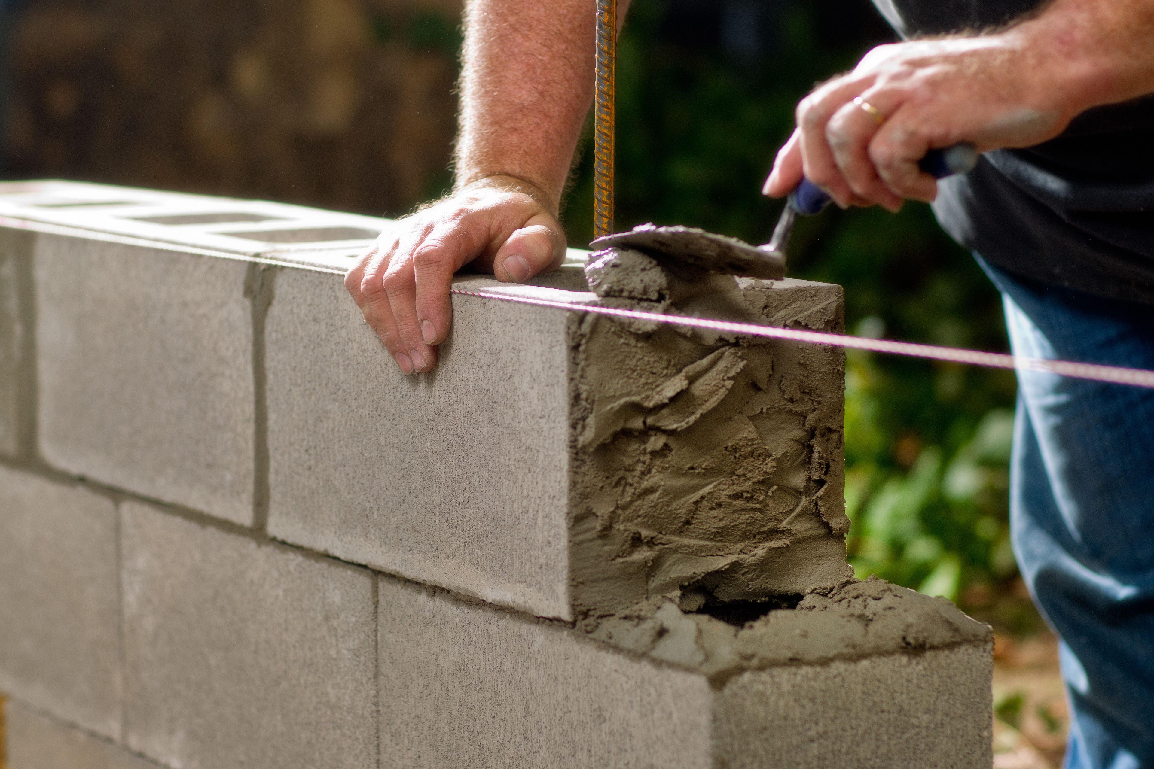 A wall being built out of concrete blocks.