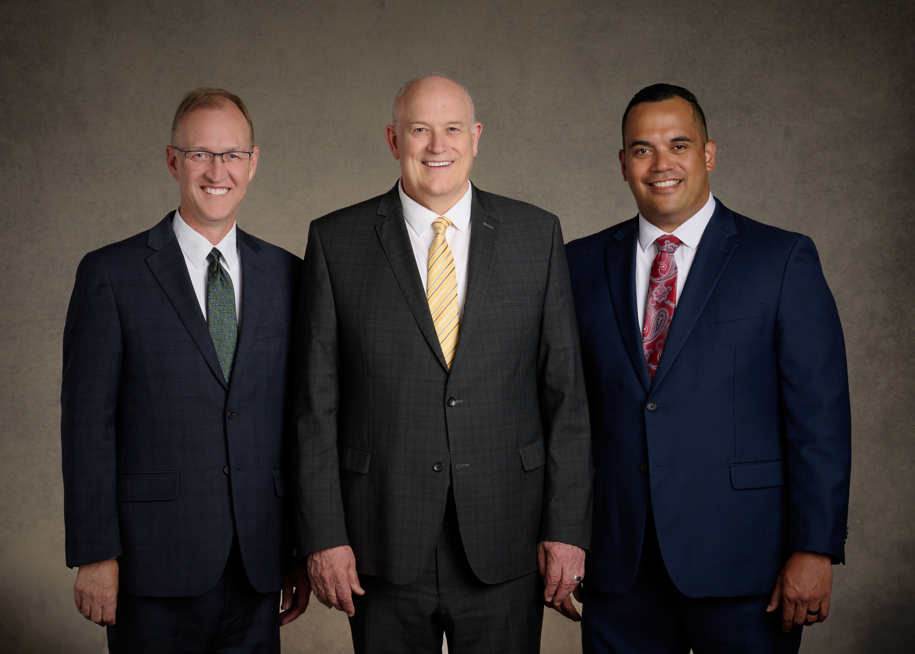 Group image of the Sunday School Presidency. Image includes: President Paul V. Johnson, Sunday School general president, Brother Chad H Webb, and Brother Gabriel W. Reid.