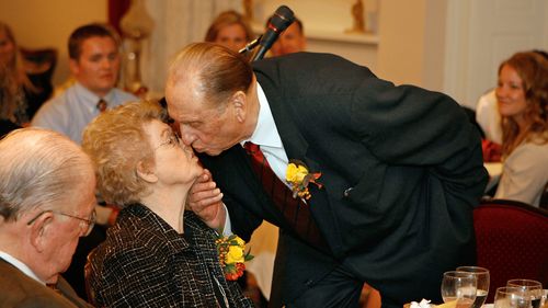 LDS Church President Thomas S. Monson gives his wife, Frances, a kiss at their 60th anniversary celebration, 10/6/2008, at the Lion House. The two met in 1944 and were married in the Salt Lake Temple on Oct. 7, 1948.