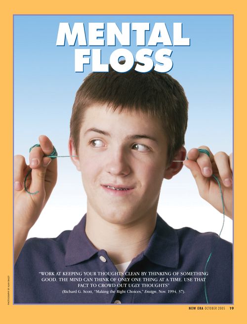A conceptual photograph of a young man pulling floss through both ears, paired with the words “Mental Floss.”