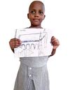 A girl named Faith holding up her drawing of the temple