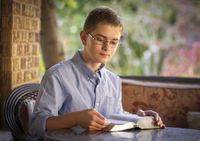 boy reading scriptures