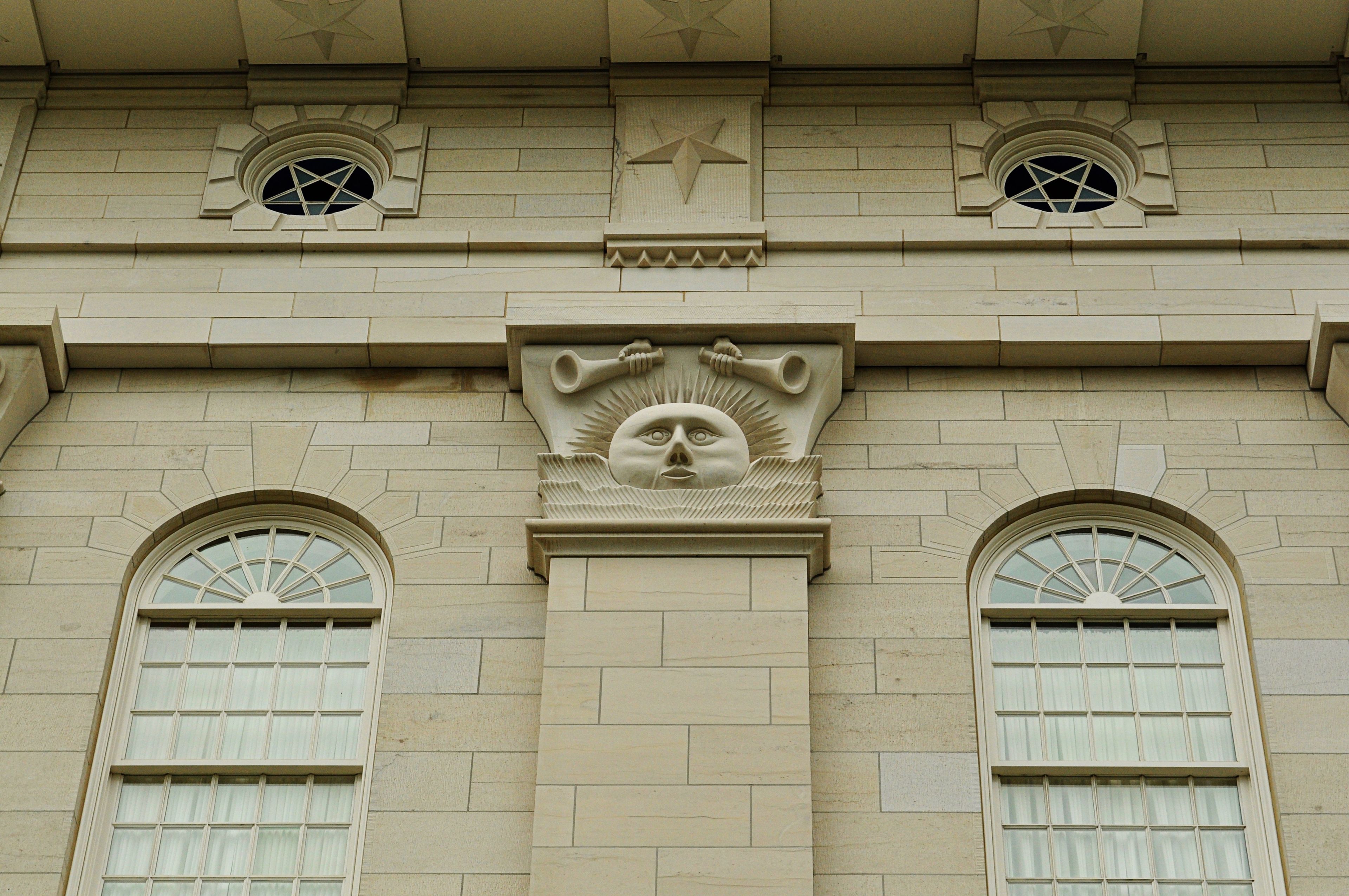 The Nauvoo Illinois Temple exterior view, including windows and symbols.