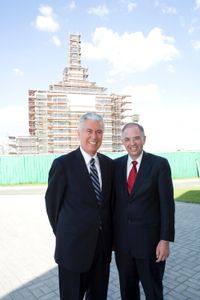 President Dieter F. Uchtdorf and Elder Neil L. Andersen stand together outside the Kyiv Ukraine Temple during its construction.