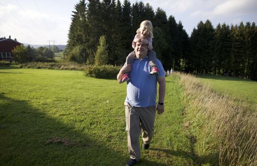 daughter on fathers shoulders