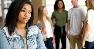 young adult woman looking sad