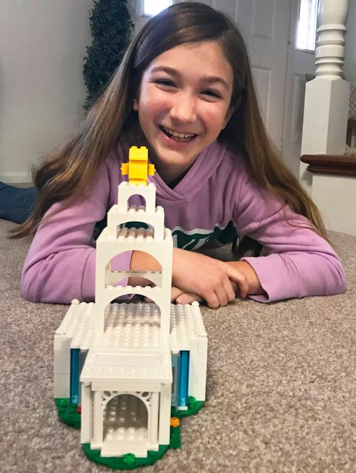 girl showing temple she built