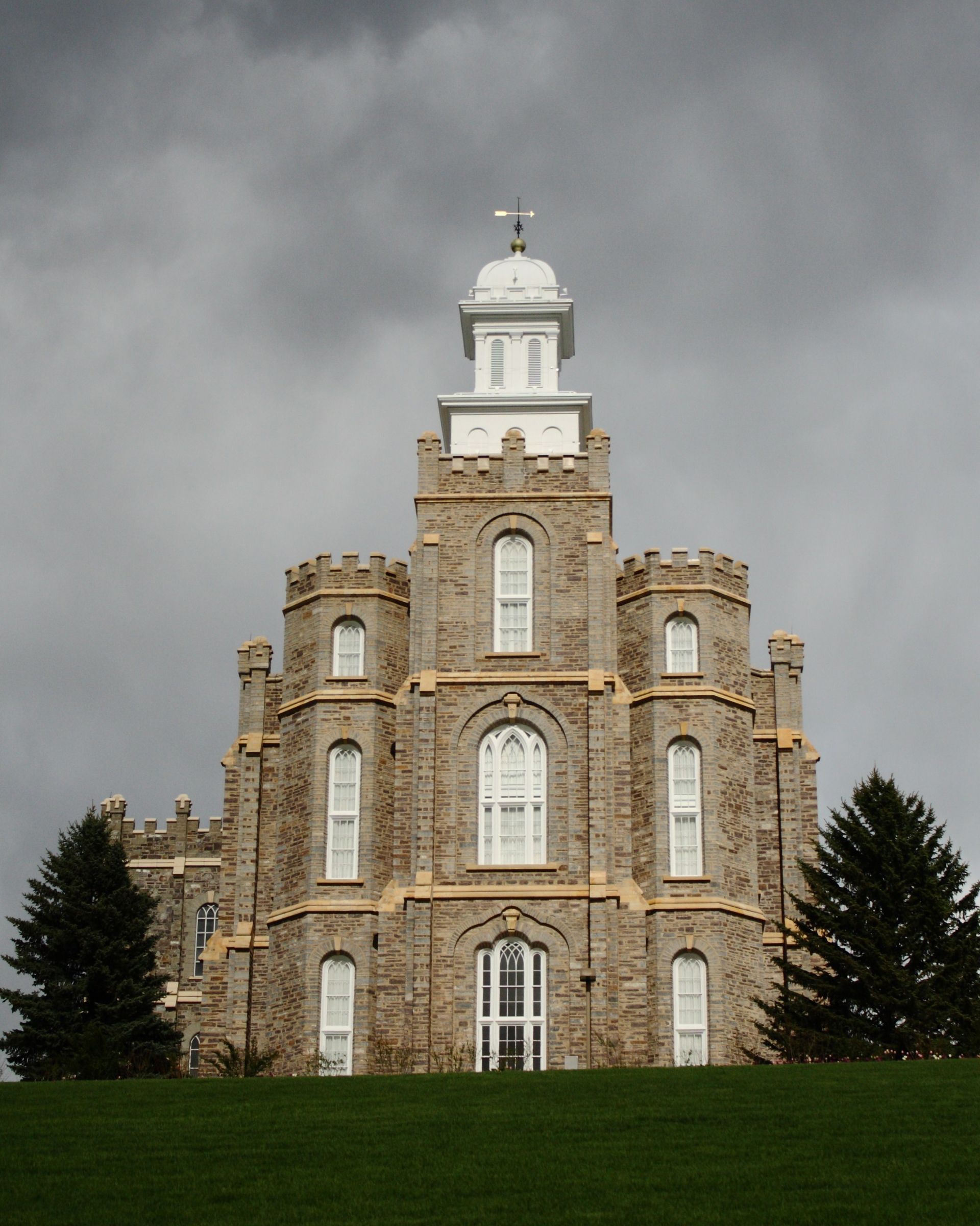 The Logan Utah Temple on a stormy day, including scenery.