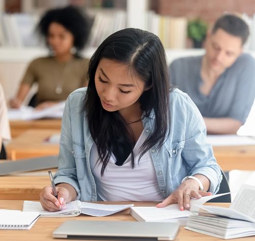 female teenager studying