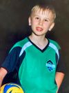 A young boy named Carter with a soccer ball