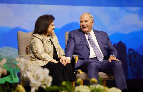 Elder and Sister Rasband looking at each other