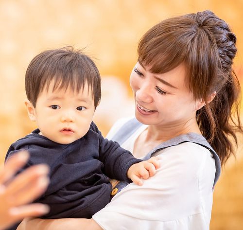 woman holding little infant