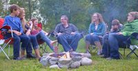 family around campfire