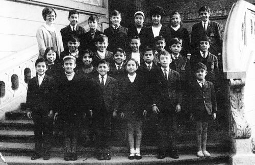 Group photo of fourth grade students at Church school in Santiago known as Colegio A. D. Palmer and Chilean teachers at school.  This photograph is one of a twenty-five-page photocopy of Flora Decker's photograph album containing snapshots she accumulated while serving in Chilean Mission during presidencies of Carl J. Beecroft and Robert H. Burton. Most images in album include some identifying information. Copies of twenty-seven images from album and index providing additional information about those items are also included