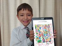 boy holding up tablet showing activity from the Friend