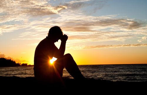 young man praying