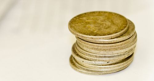 Stack of old silver coins.