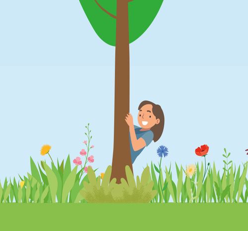 girl hiding behind tree