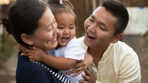 young family laughing