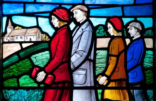stained-glass window of family going to church