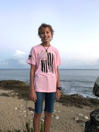 boy standing on beach